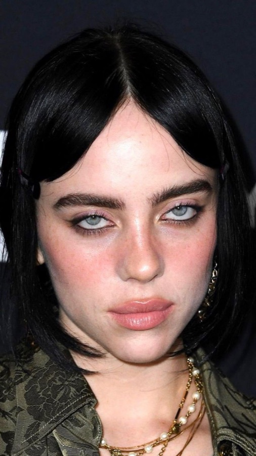 Billie Eilish showing sanpaku eyes — white visible around the iris