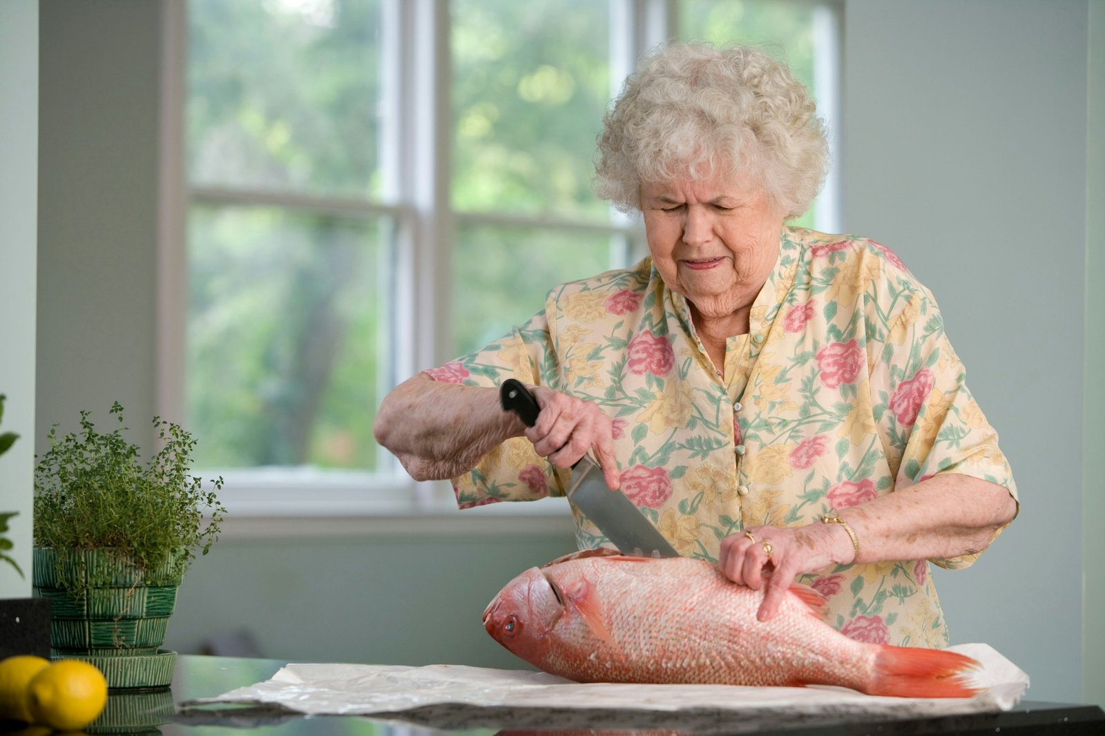 Older woman cooking in her kitchen