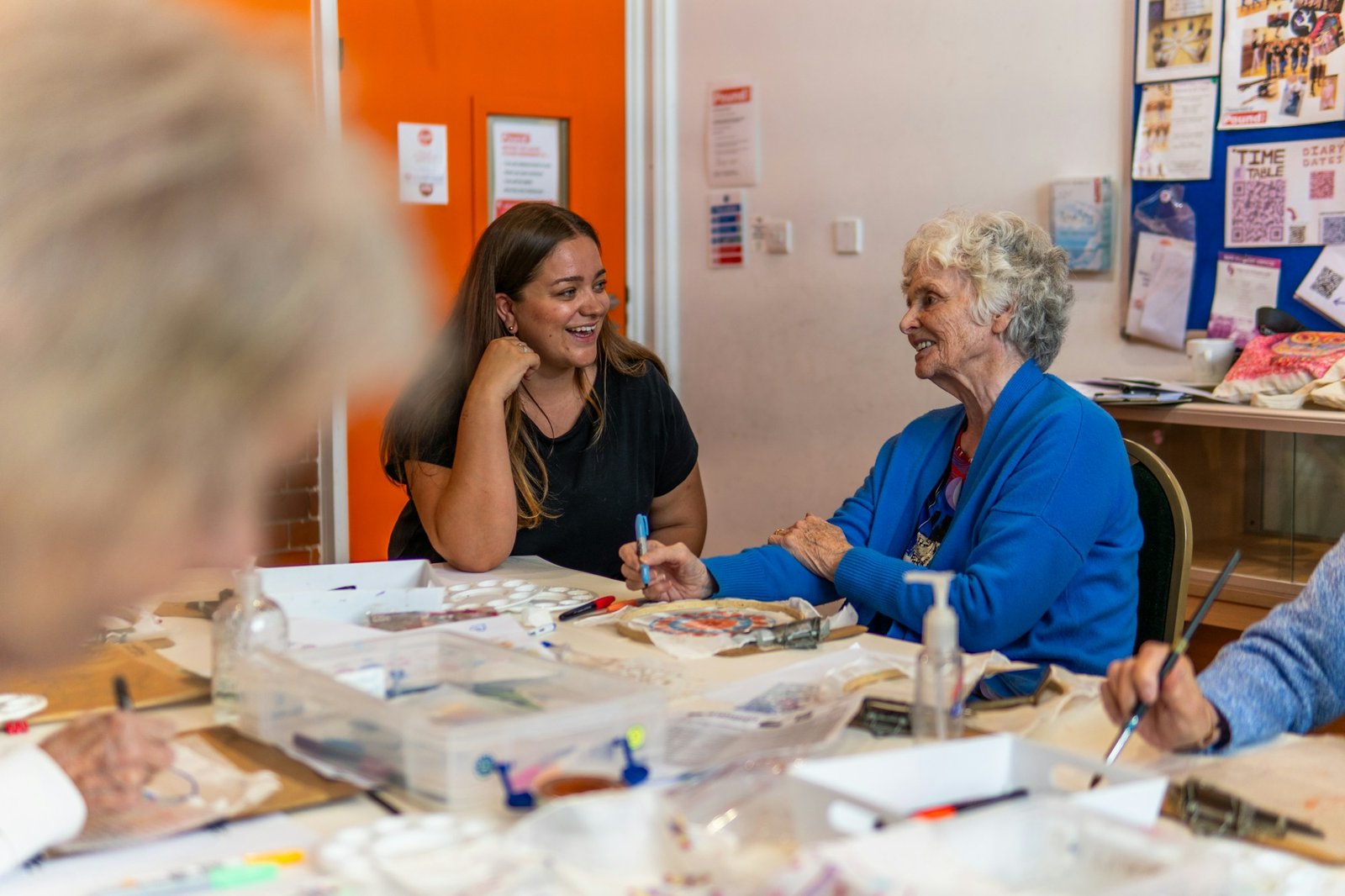 Smiling older woman at a community arts and crafts class