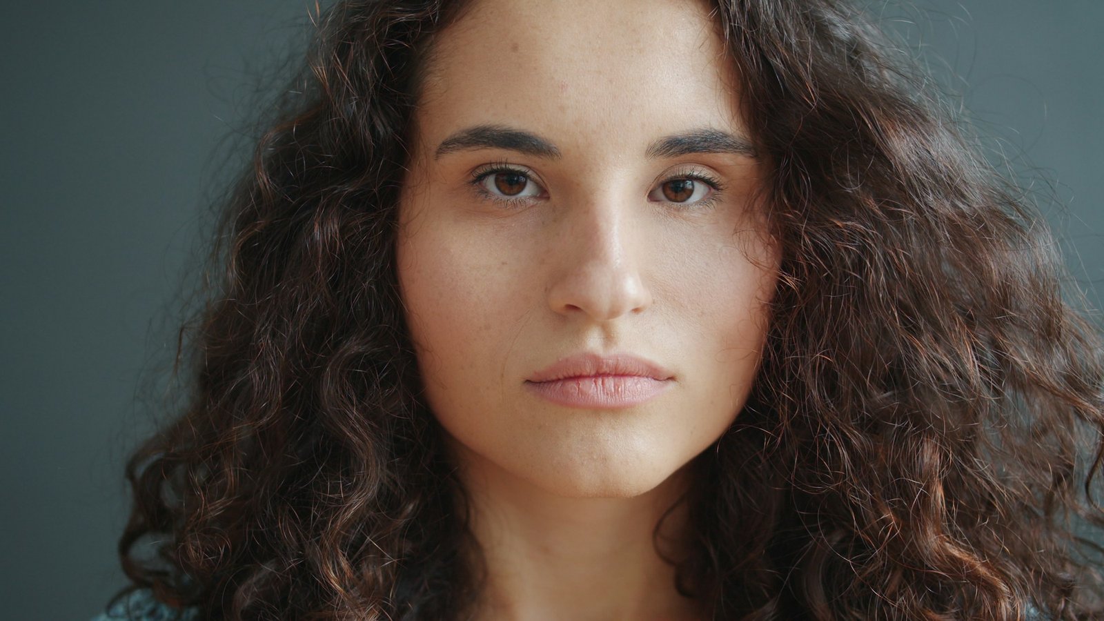Woman with a calm, steady, unhurried gaze