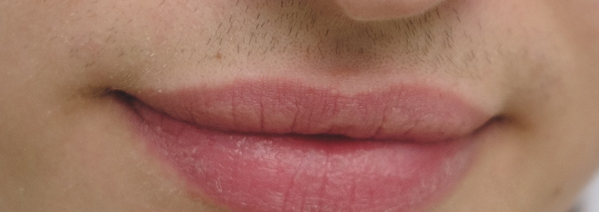 Close-up of closed lips and the corners of the mouth