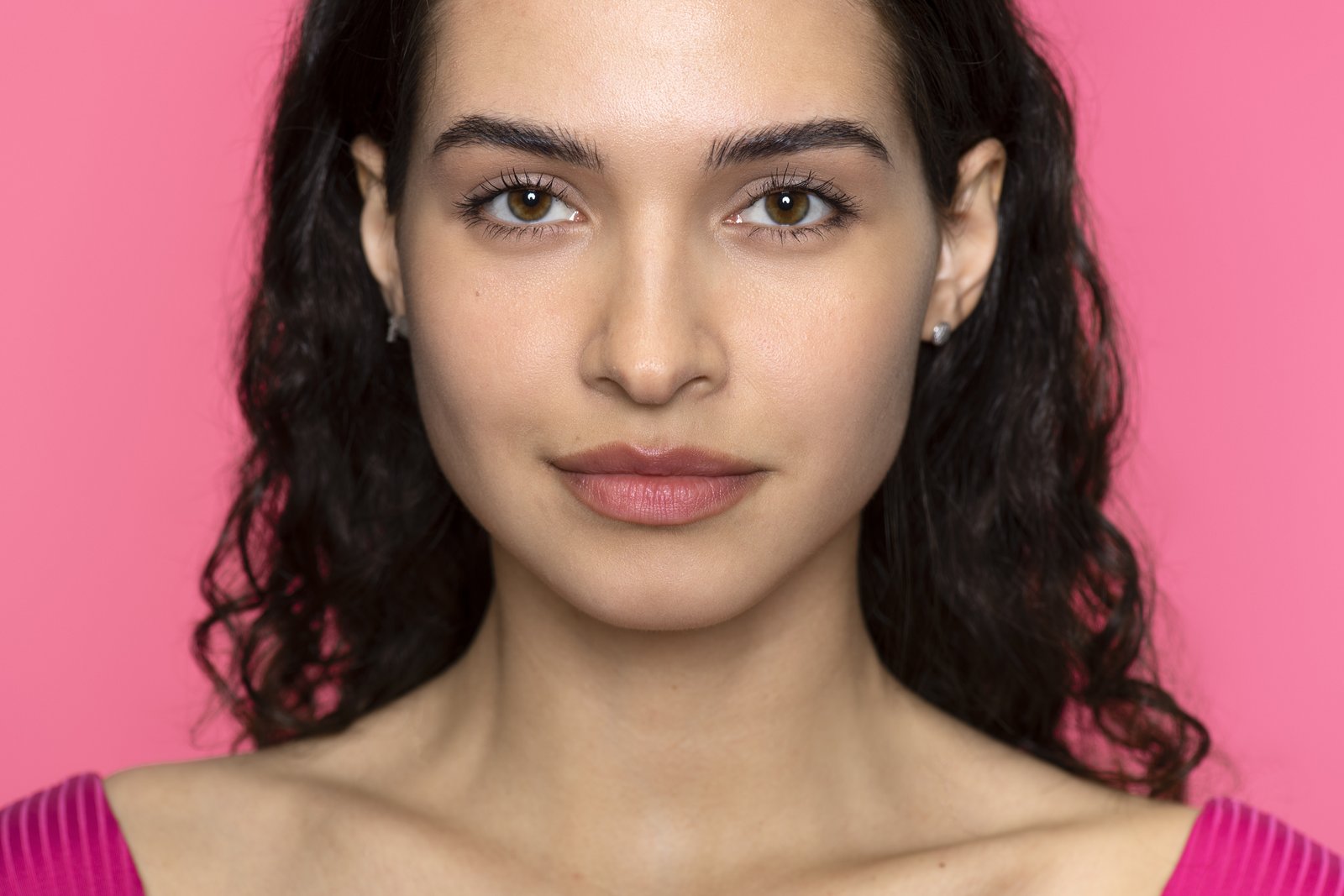Woman with balanced, evenly proportioned features and a calm expression