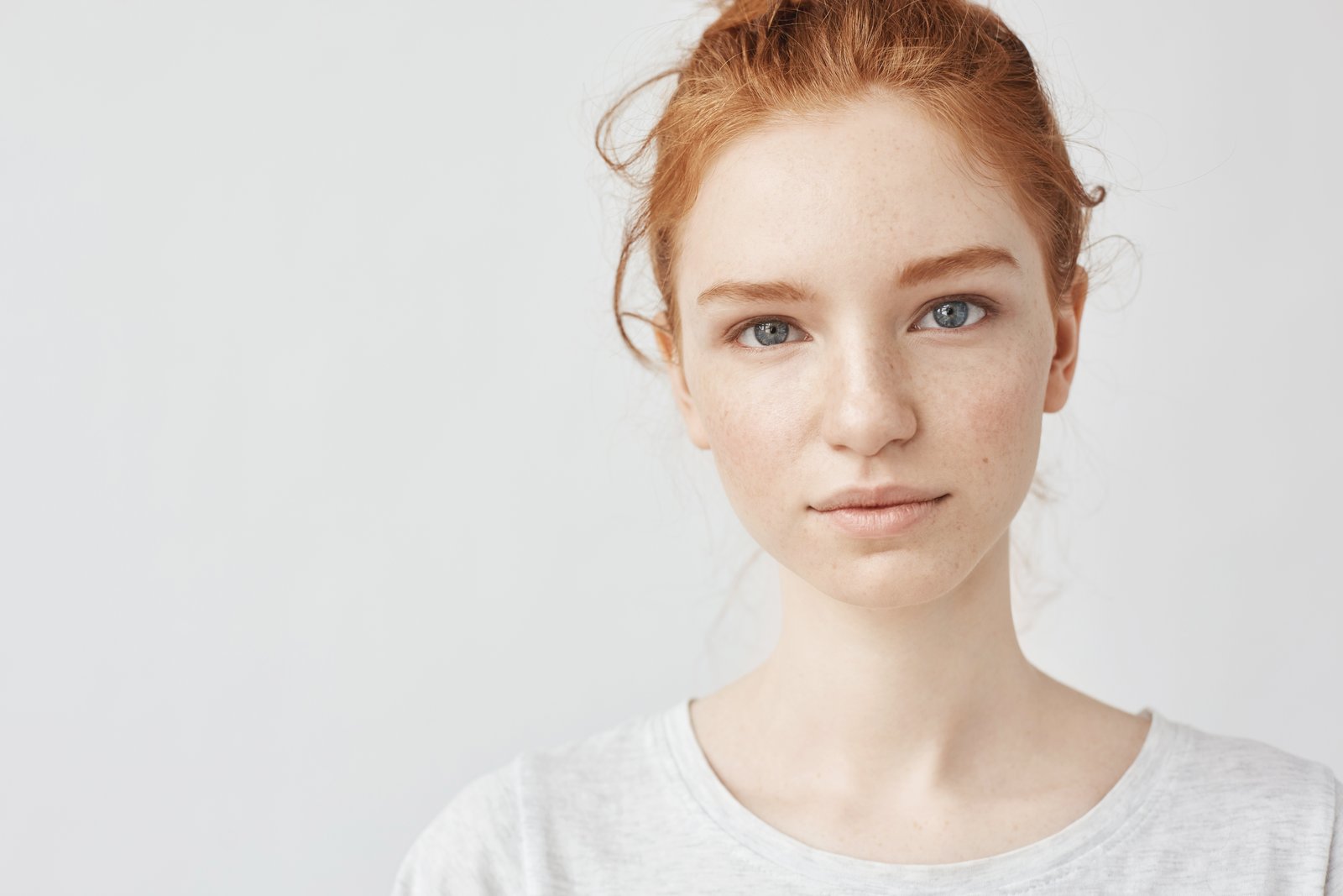 Woman with a gentle, warm expression and a soft natural smile