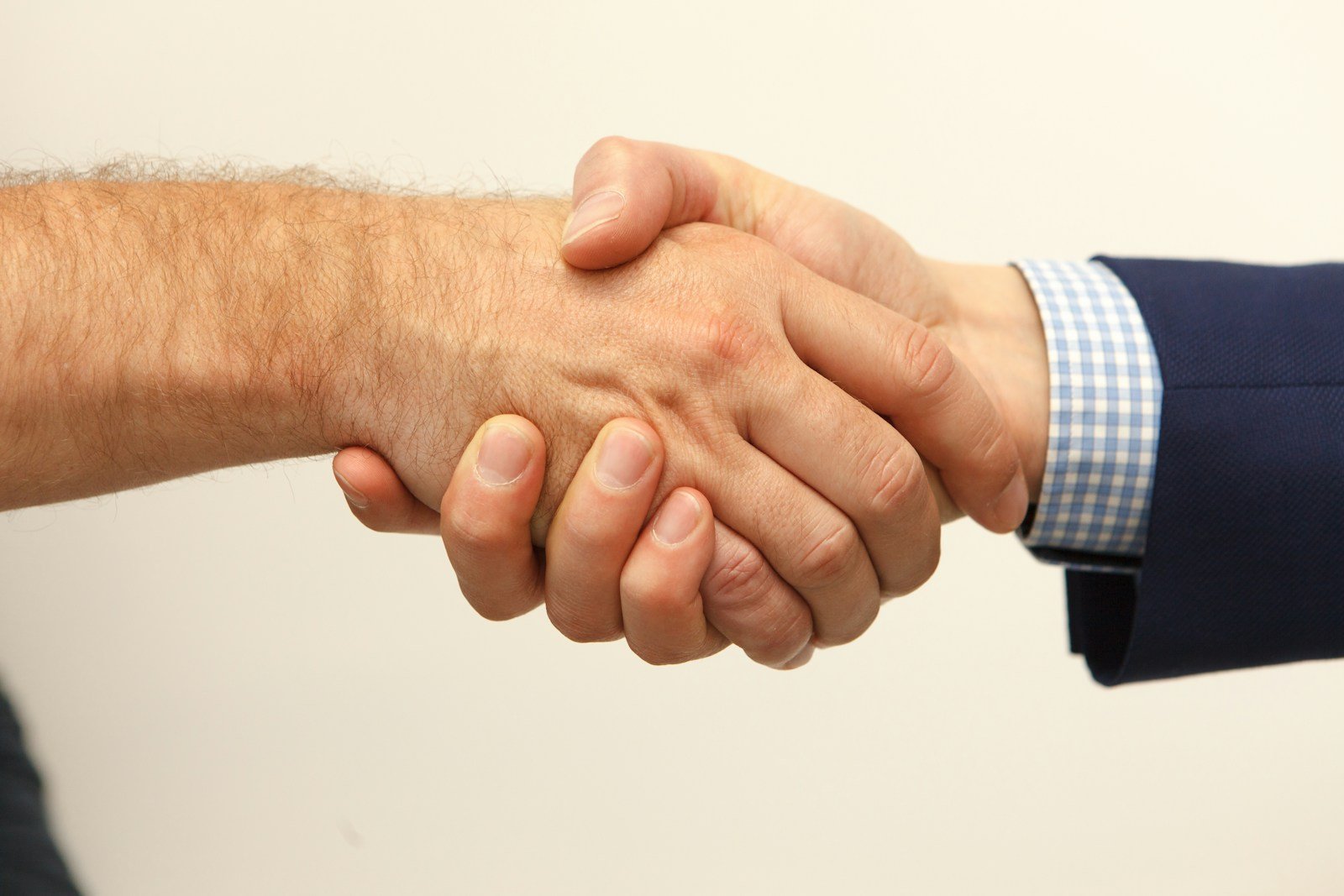 Close-up of two people shaking hands