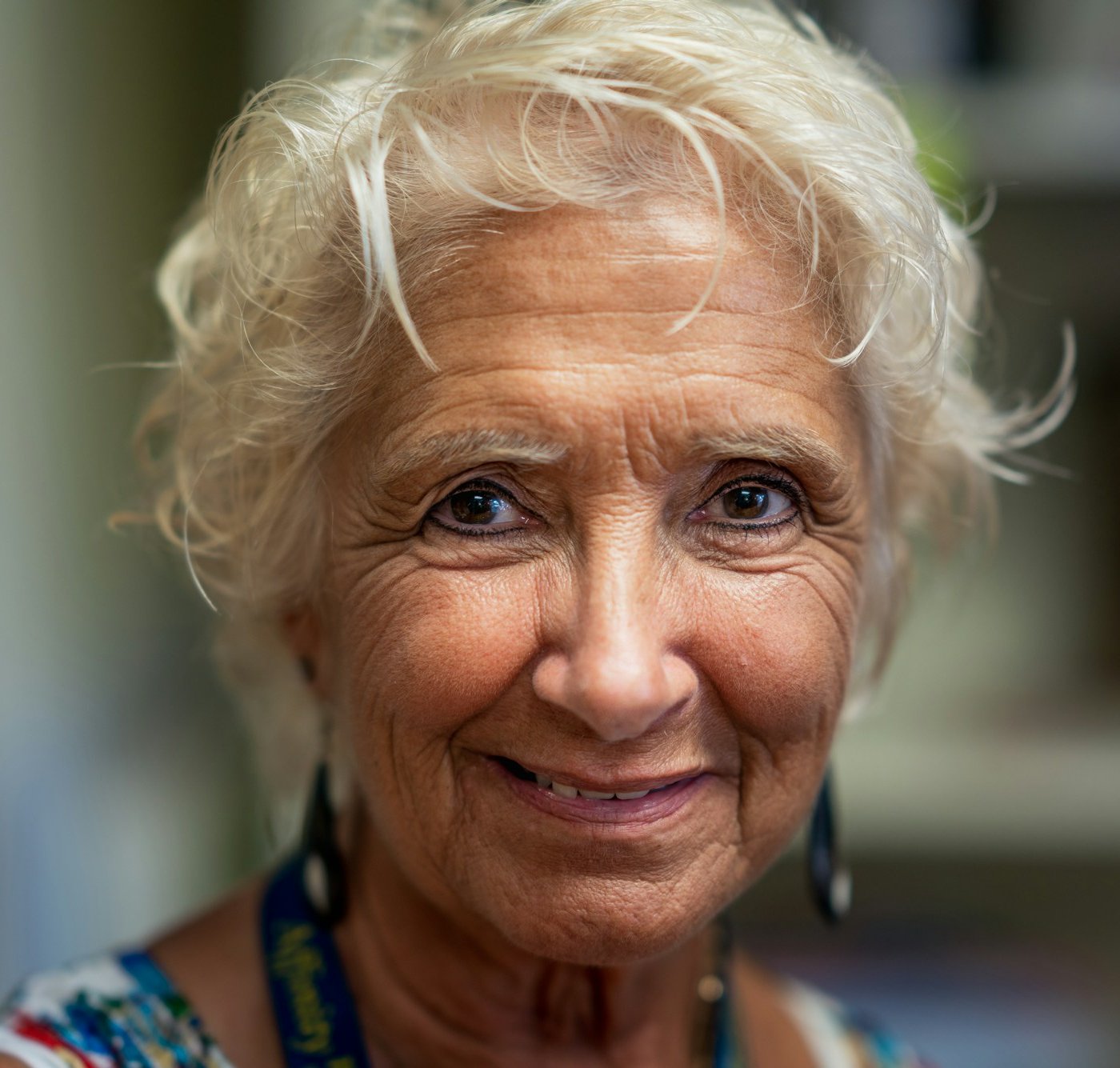 Smiling older woman with symmetrical nasolabial wrinkles
