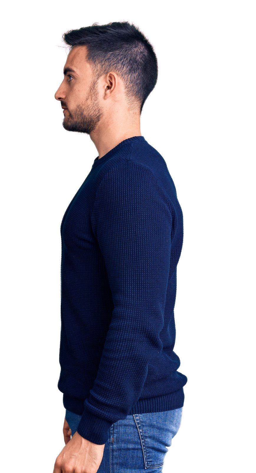 Fair-skinned man standing upright in profile against a white background