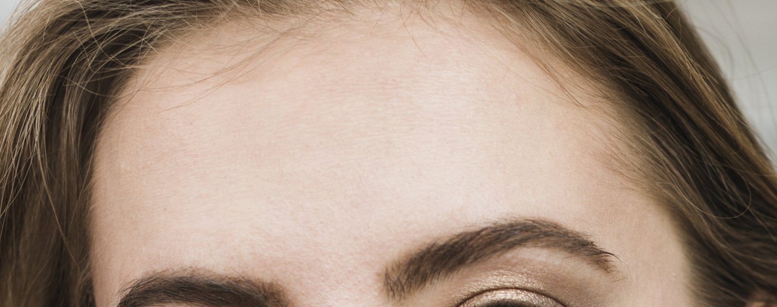 Close-up of a smooth forehead with firm, bright skin