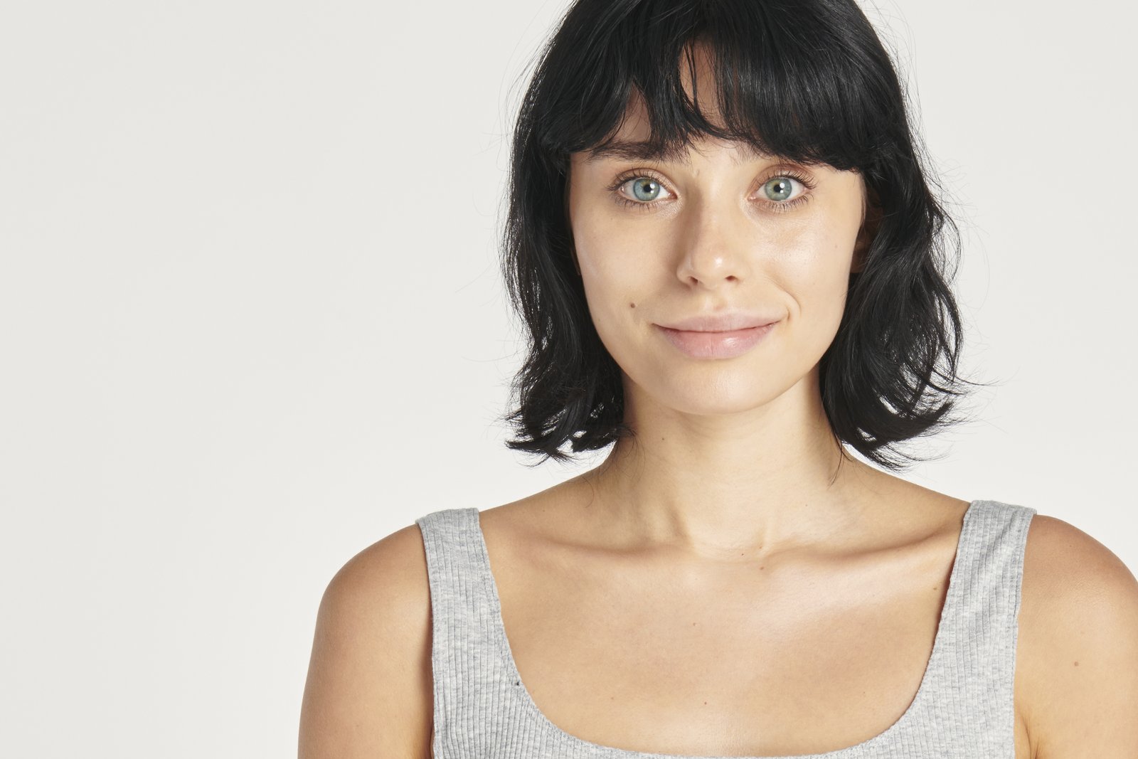 Front-view portrait of a woman's whole face with a relaxed expression