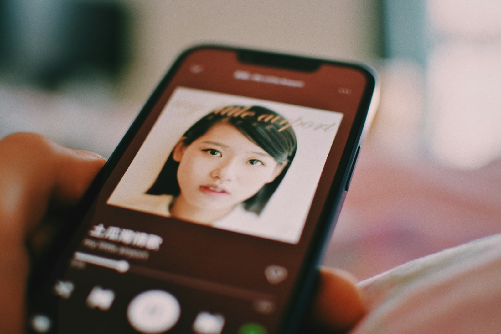 Phone screen showing a beauty-filter app editing a portrait