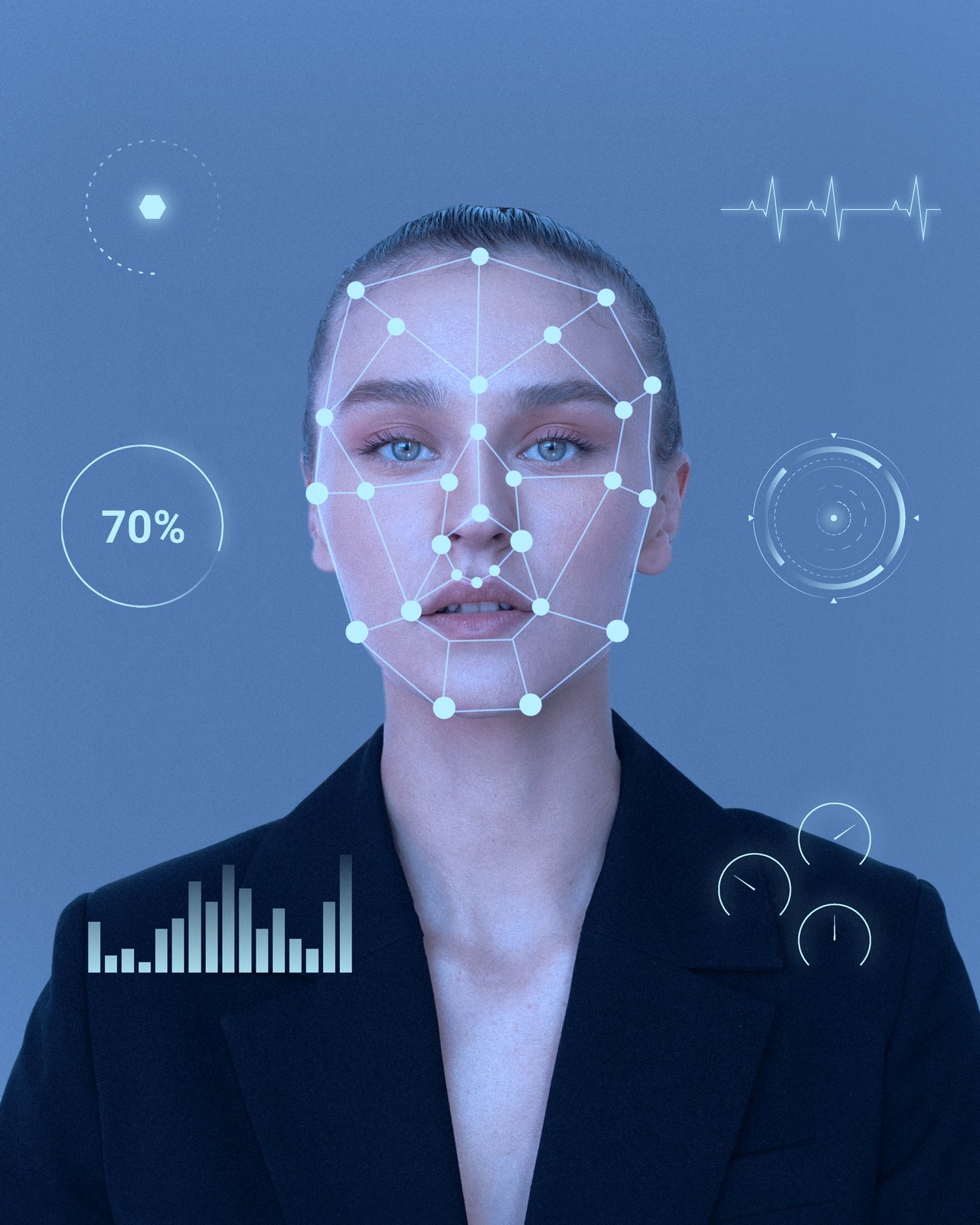 Woman's face overlaid with a facial-recognition mesh and data readouts
