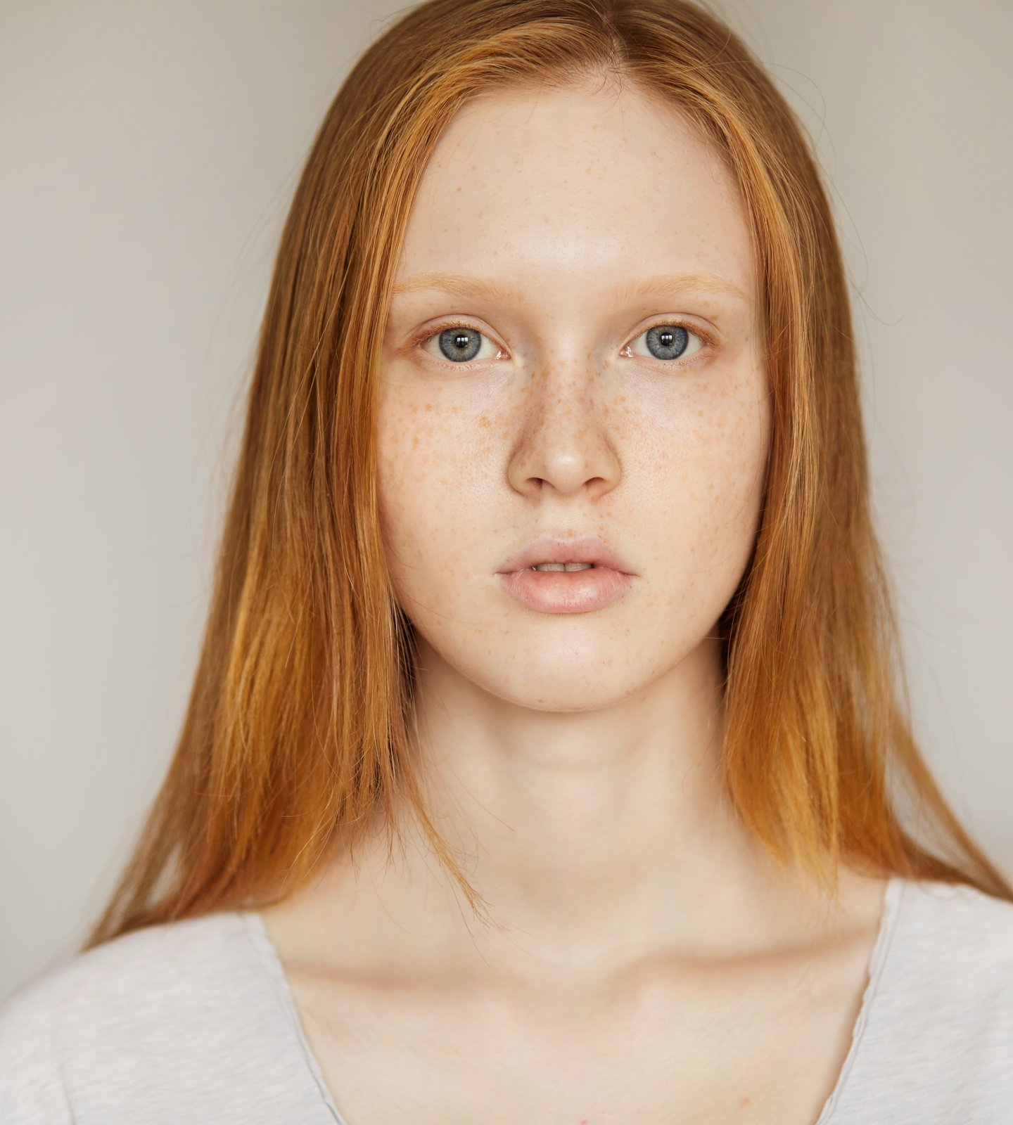 Young woman without makeup looking straight at the camera