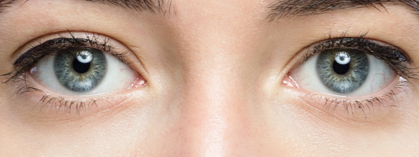 Close-up of a pair of eyes with a little white showing beneath the iris