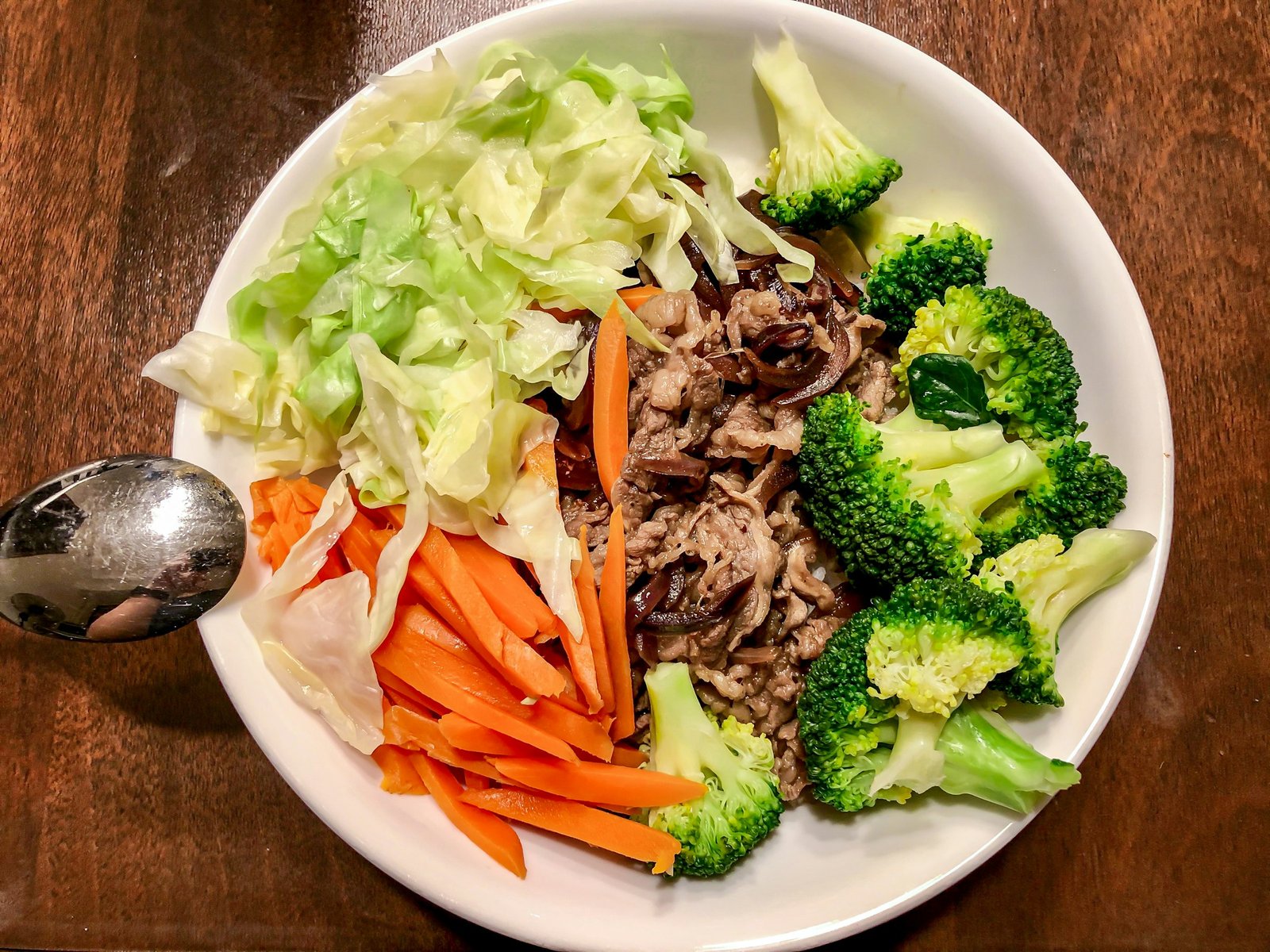 Plate of brown rice with vegetables